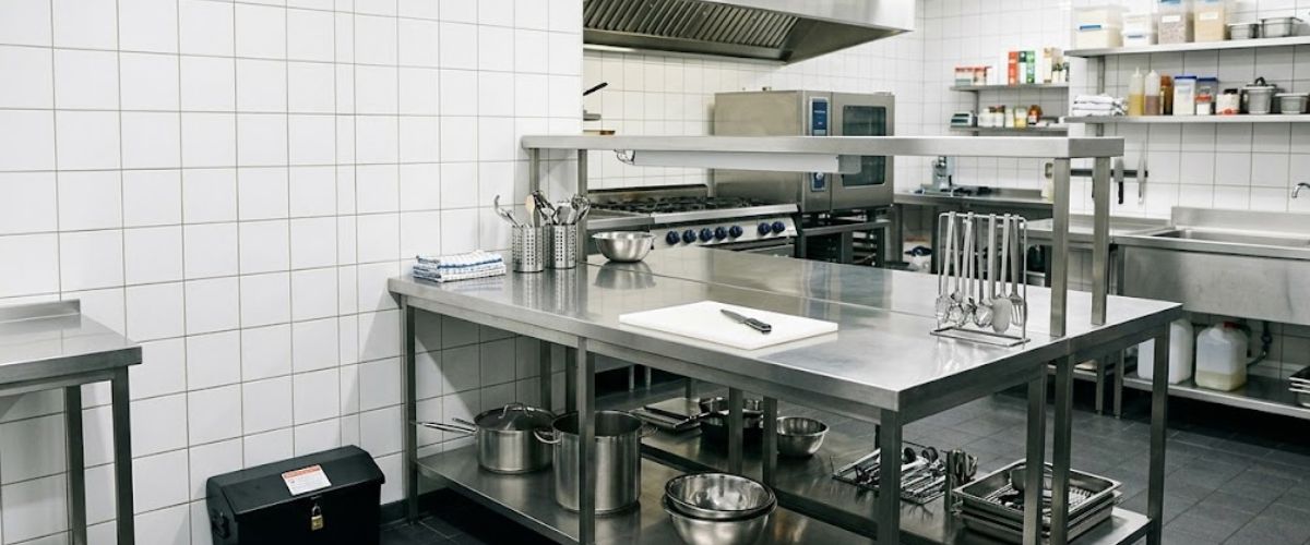 Technician servicing rodent control station in Chattanooga commercial kitchen